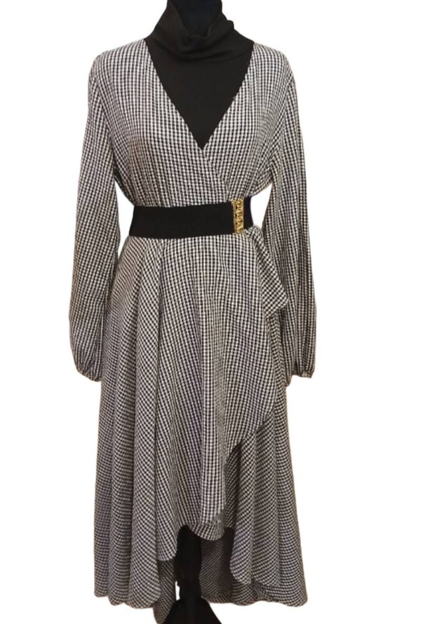 Black And White Checkered Ruffle Front Dress. High/Low Hem. Elastic Hem Sleeved. Size Large. Front Length 36", Back Length 54". 65%Cotton/35% Polyester.