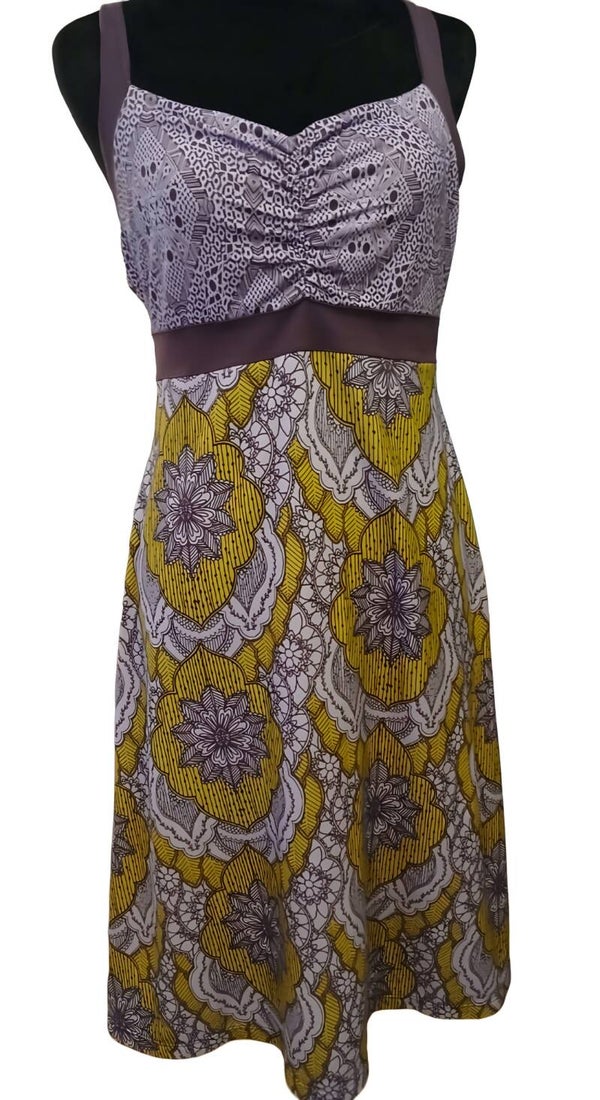 Sundress/Jumper. Eggplant Purple with Lime Green and Light Purple Flower Designs. Has Support Bra Made In.Size Small. Length 33" 45% Recycled Polyester/45% Polyester/10% Spandex