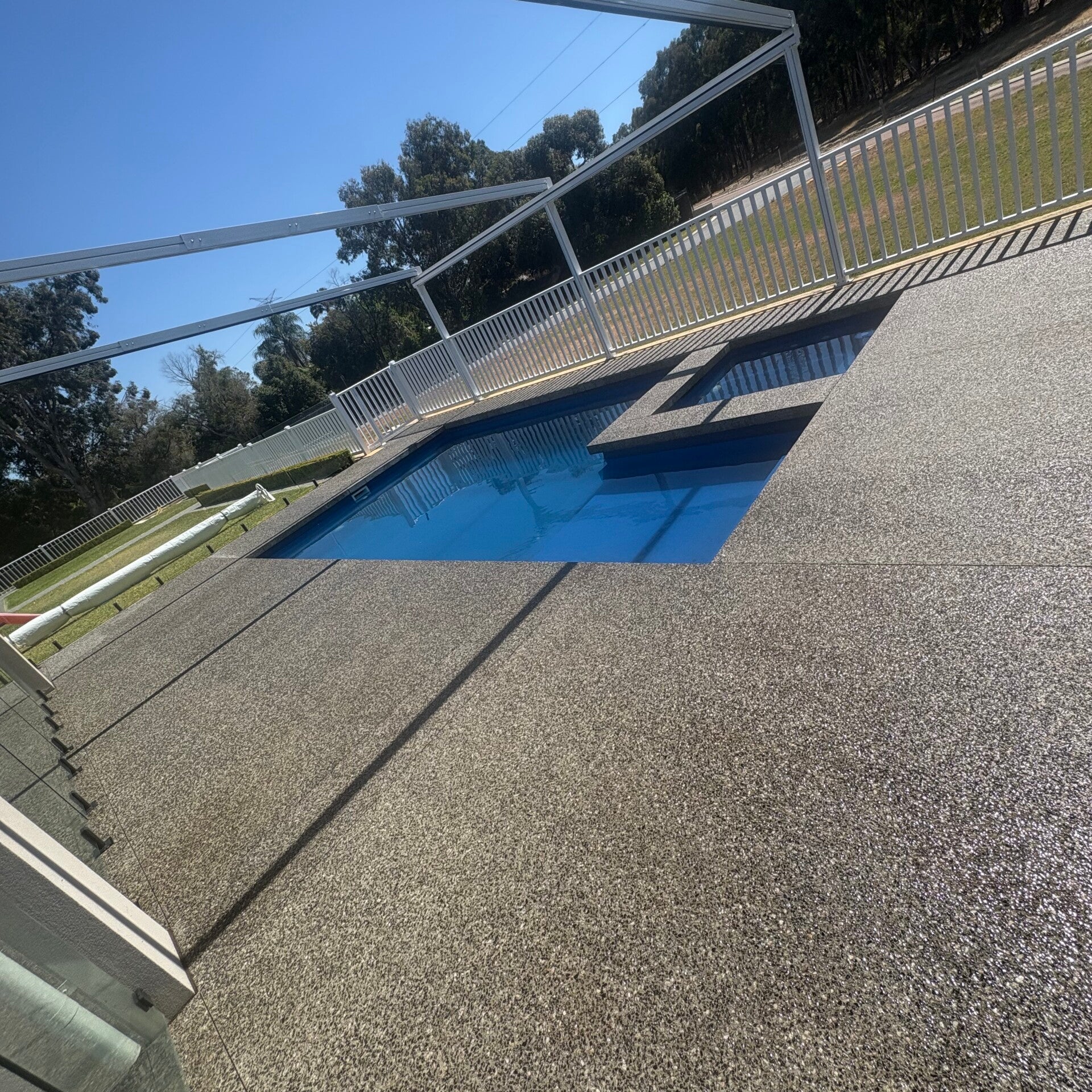 Clean pool area after pressure washing service