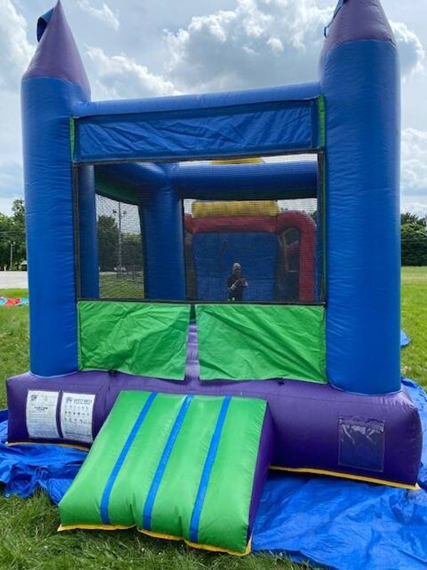 Green and Blue - Medium size inflatable bounce house.
