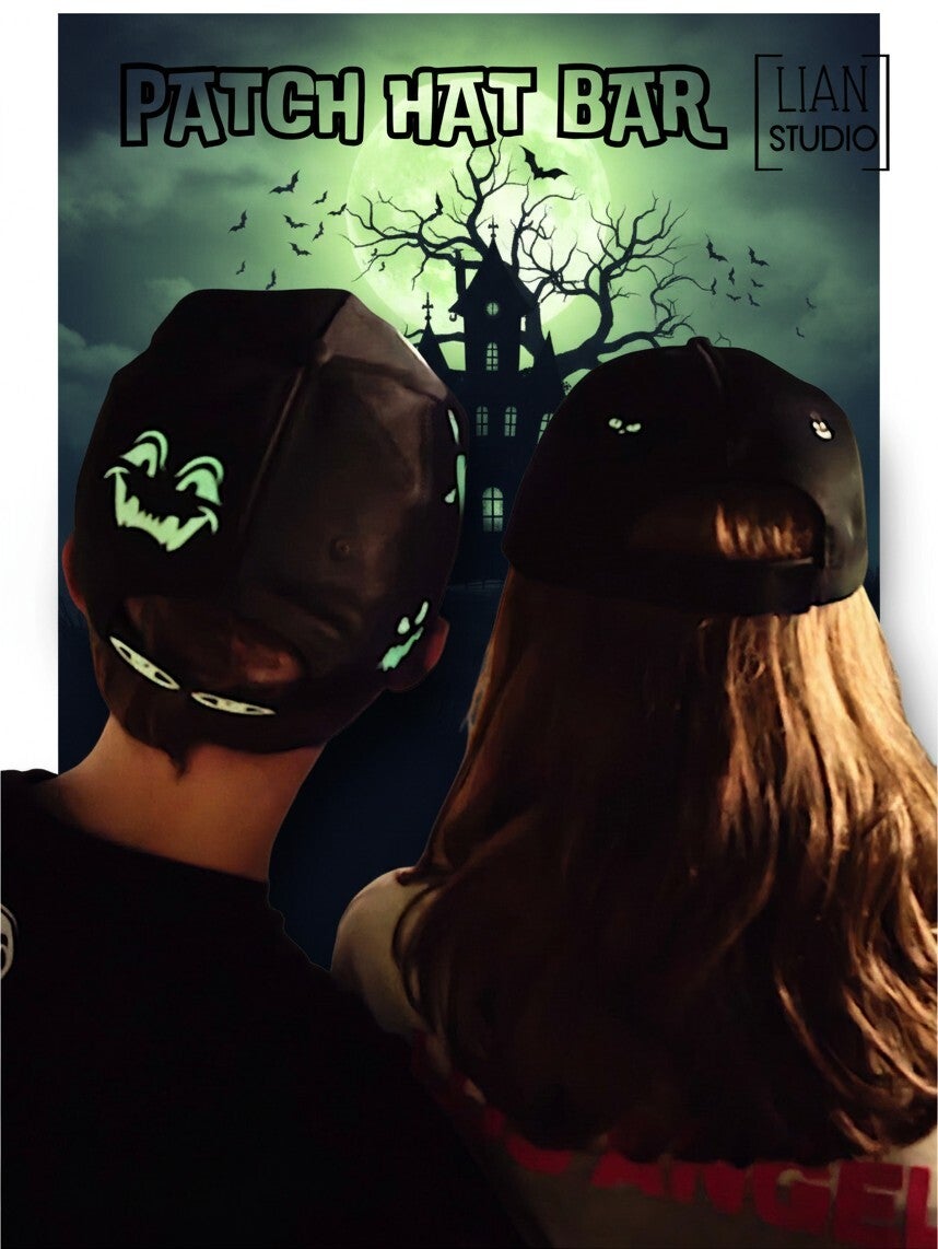 Achterkant van de Fright Bite Halloween cap met allerlei glow-in-the-dark monstergezichtjes over de hele cap verspreid, handbedrukt door LIAN Studio's Patch Hat Bar