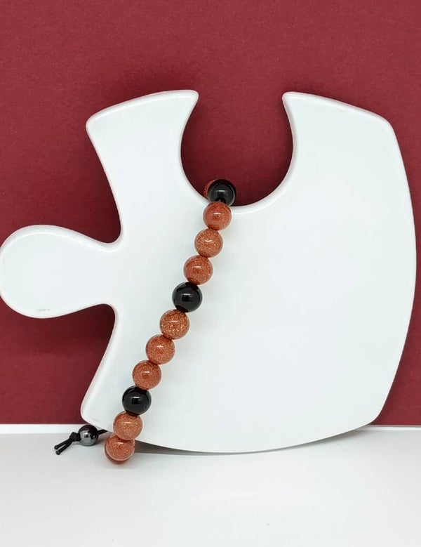 Bracelet artisanal onyx noir et perles scintillantes dorées – Nuit Céleste