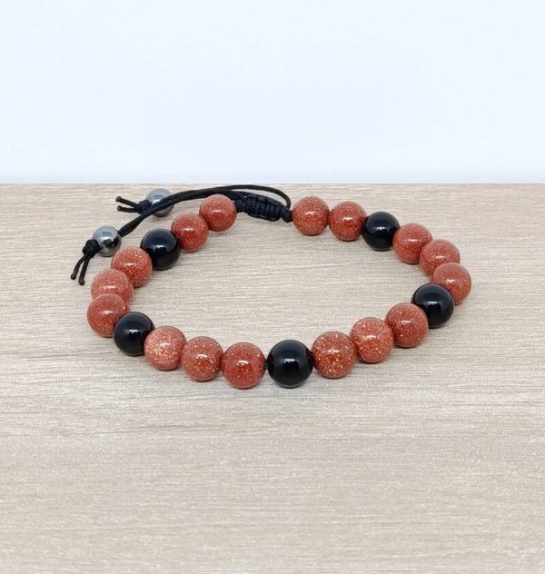 Bracelet artisanal onyx noir et perles scintillantes dorées – Nuit Céleste