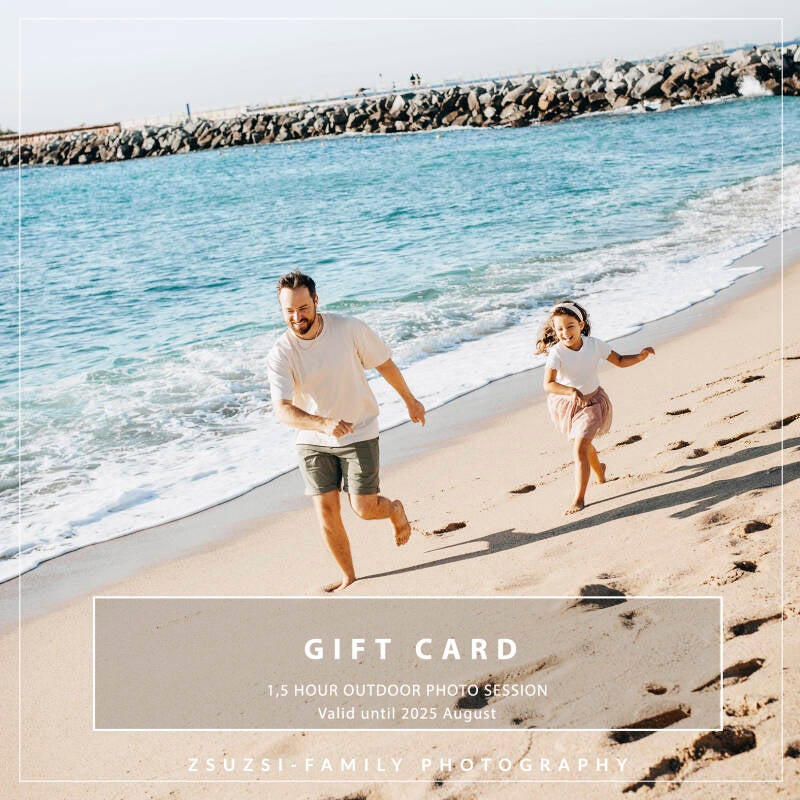 Family beach photoshoot in Barcelona with kids playing in the sand
