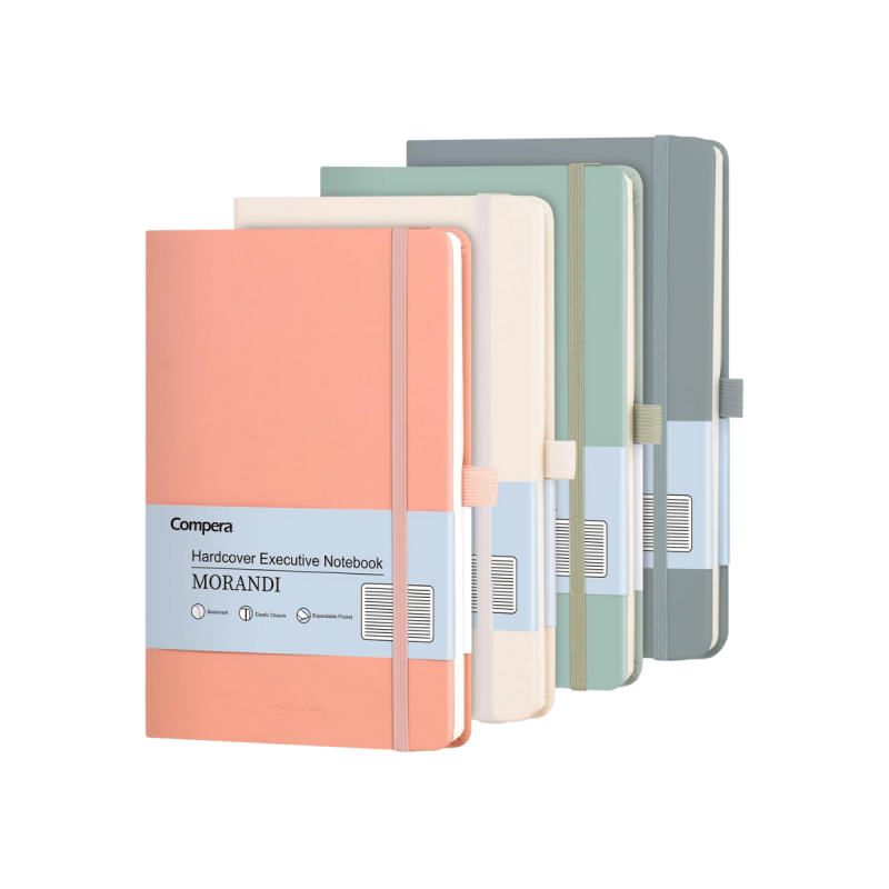 Four small hardcover journals in soft neutral tones stacked neatly on a clean surface, designed for everyday writing