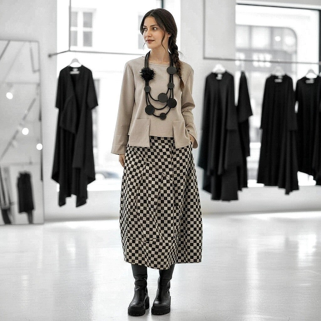 Rock mit Gummibund in modischer Tulpenform in schwarz-sand kariert