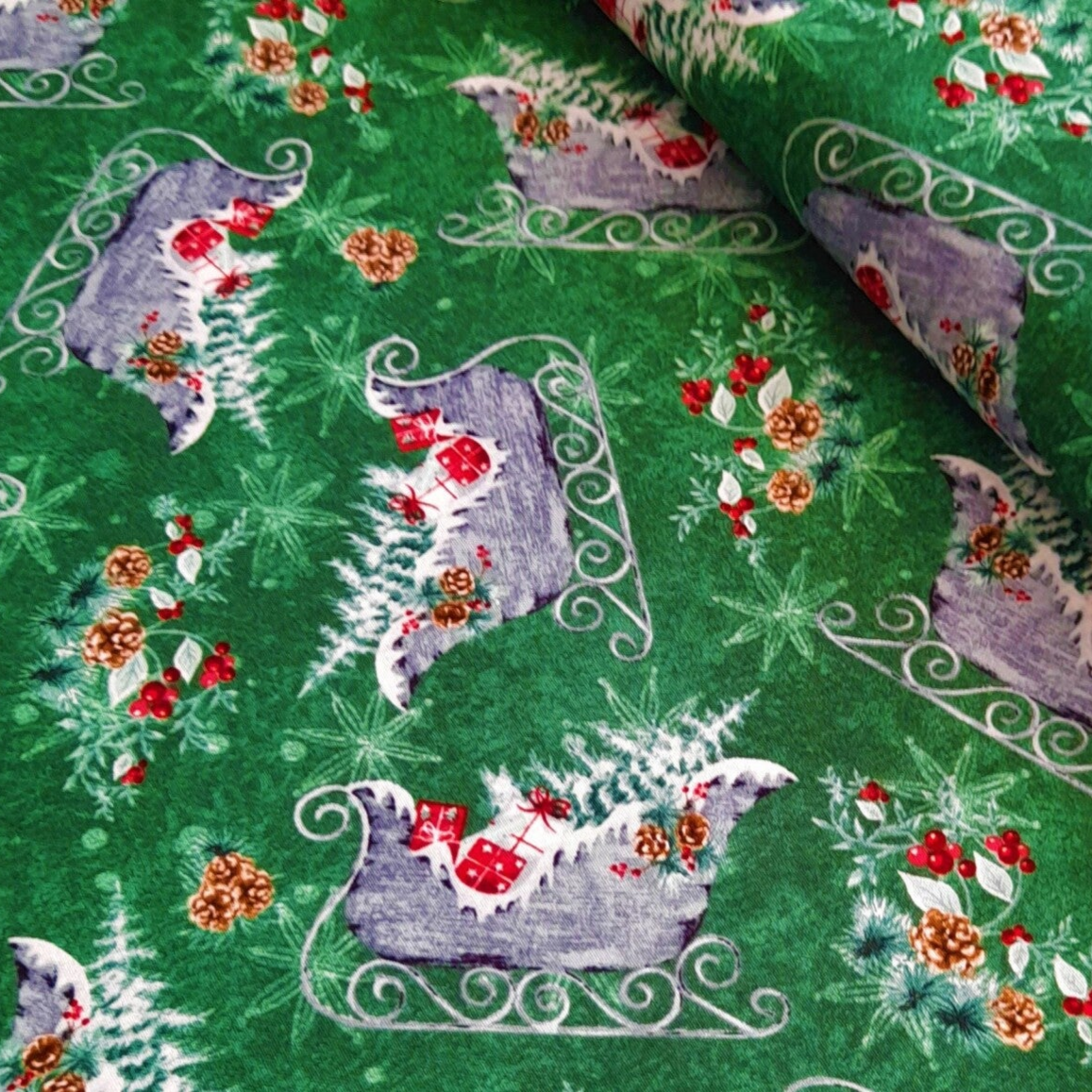 Baumwollstoff Schlitten grün