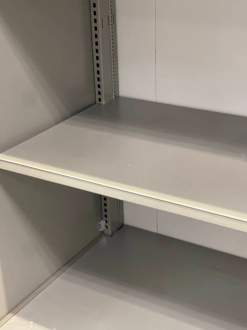Clean metal shelving free of mold and residue, showcasing thorough professional mold‑removal and deep‑cleaning results.