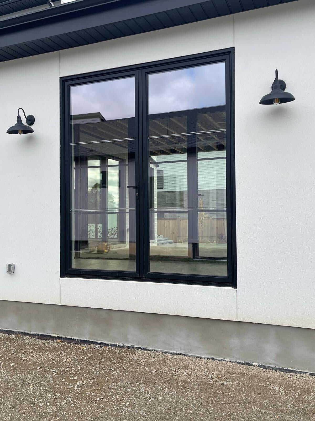 Modern residential windows with clear, streak‑free glass and clean black framing showcasing professional exterior window cleaning.