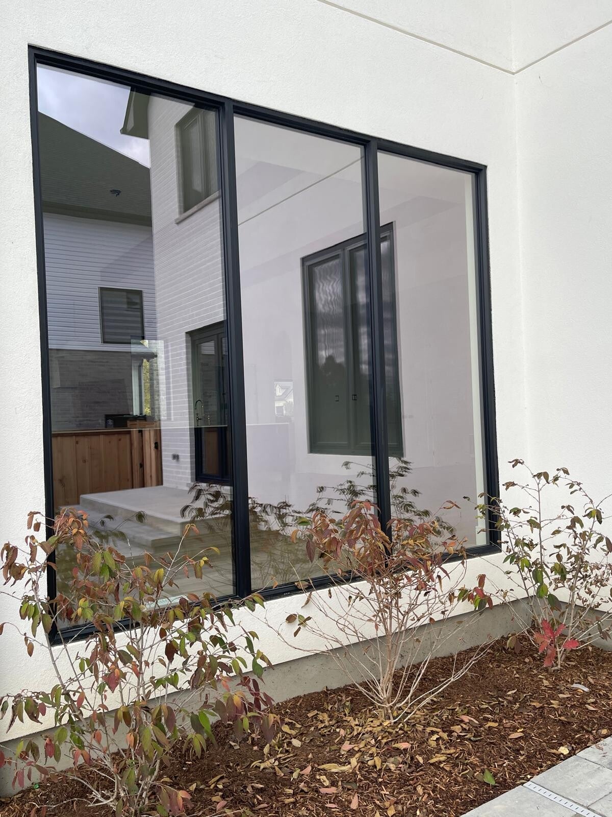 Clean modern windows and sliding glass doors with clear, streak‑free surfaces highlighting professional residential cleaning quality.