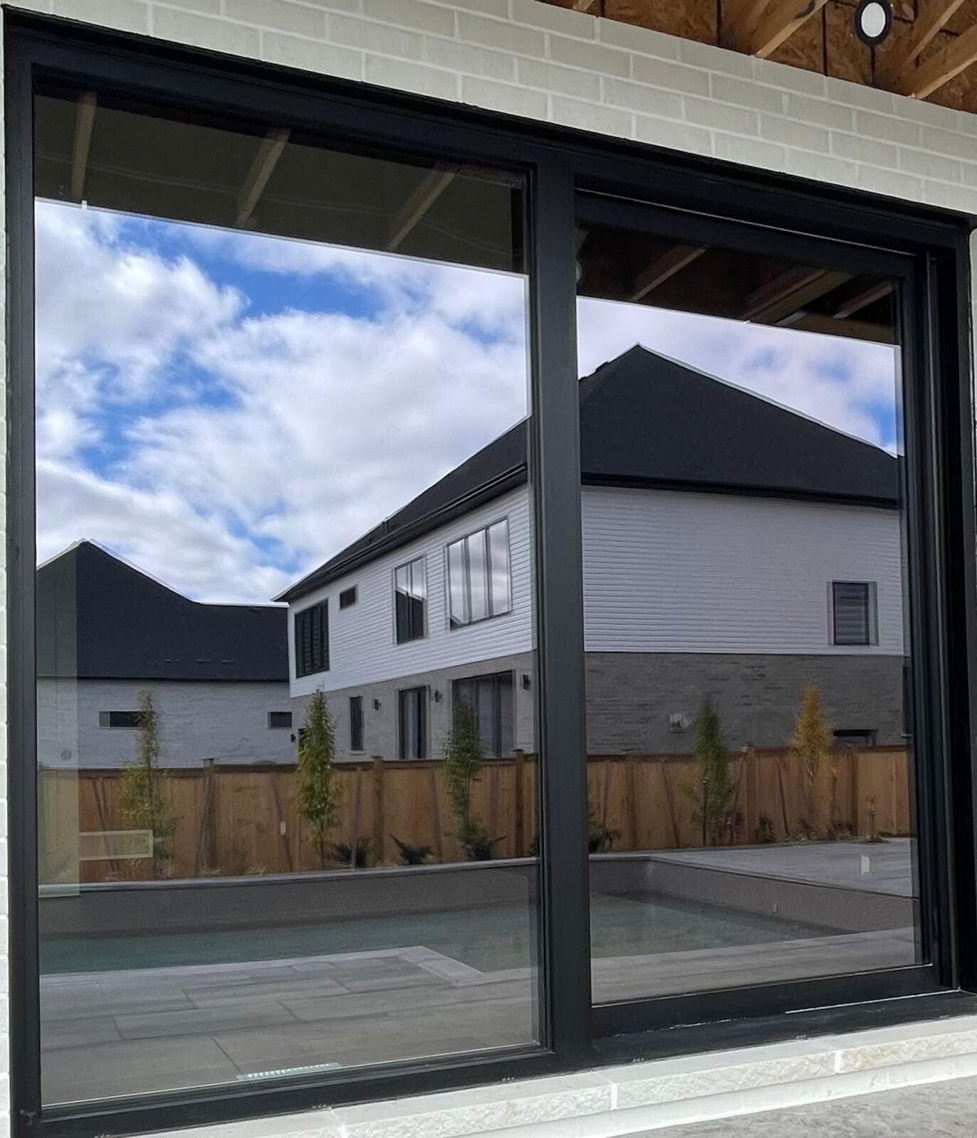 Clean modern windows and sliding glass doors with clear, streak‑free surfaces highlighting professional residential cleaning quality.