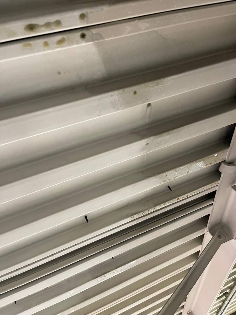 Cleaned metal ceiling panels with soot removed, highlighting professional fire‑damage cleanup and restoration quality.