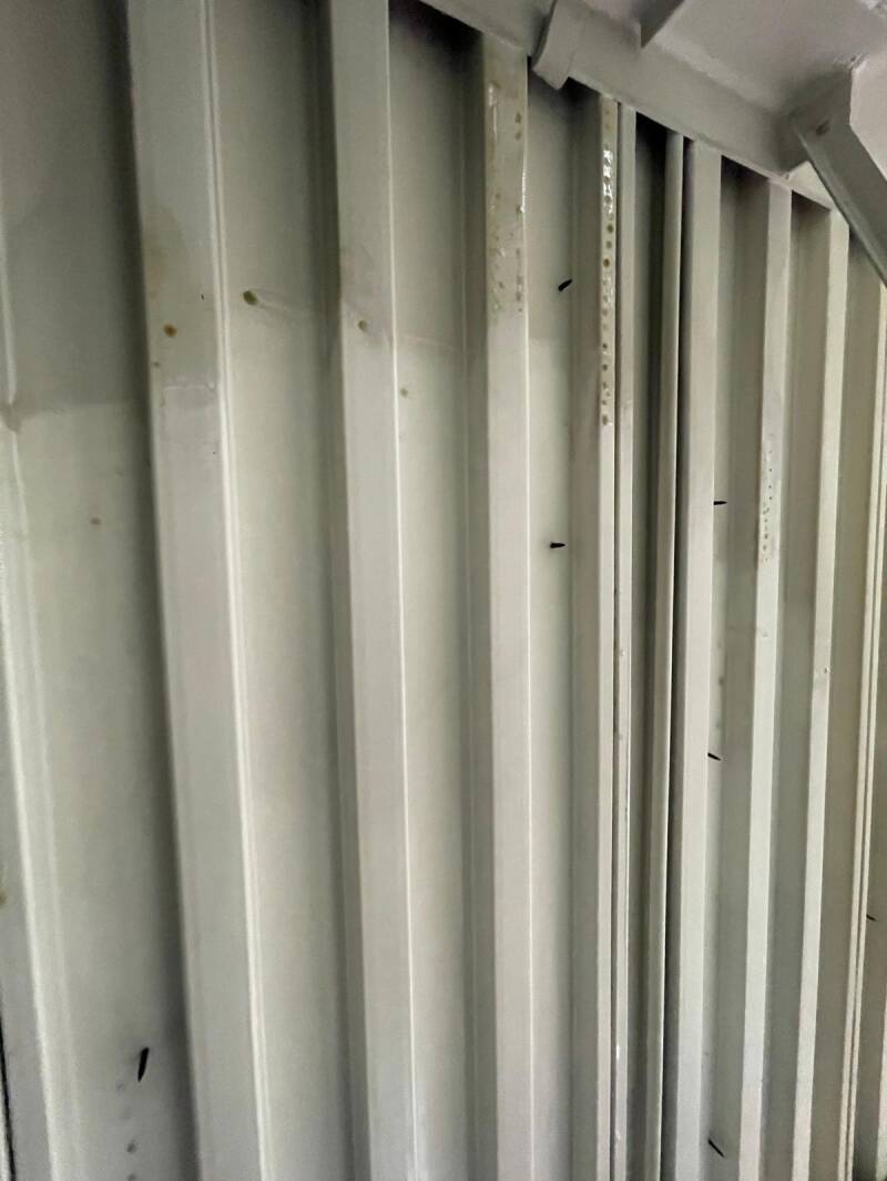 Cleaned metal ceiling panels with soot removed, highlighting professional fire‑damage cleanup and restoration quality.