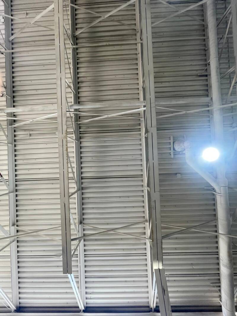Cleaned metal ceiling panels with soot removed, highlighting professional fire‑damage cleanup and restoration quality.