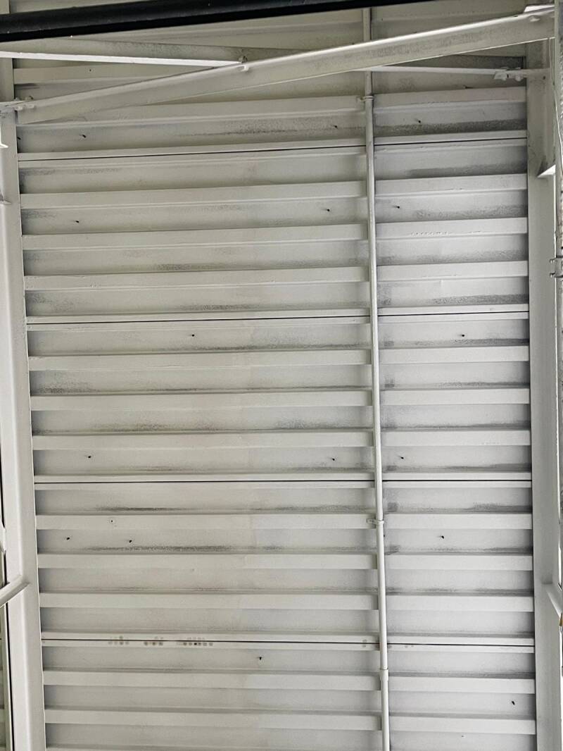 Cleaned metal ceiling panels with soot removed, highlighting professional fire‑damage cleanup and restoration quality.