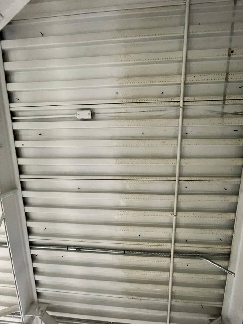 Cleaned metal ceiling panels with soot removed, highlighting professional fire‑damage cleanup and restoration quality.