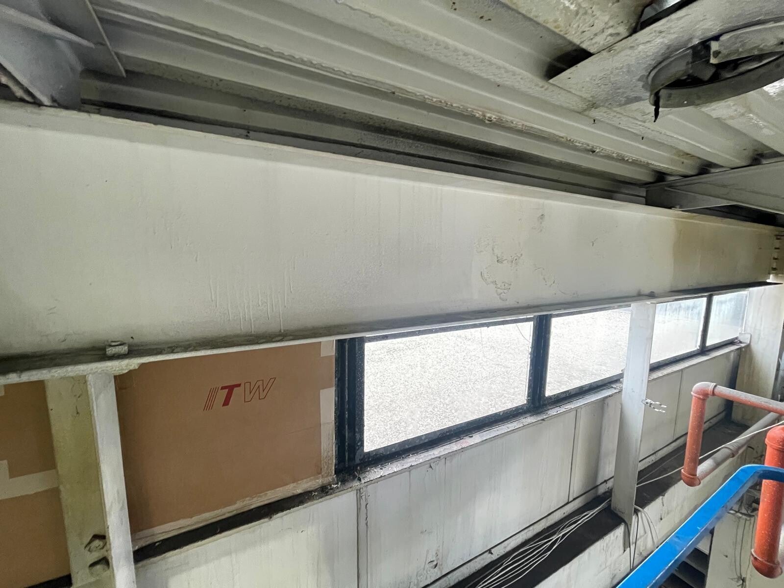 Cleaned metal ceiling panels with soot removed, highlighting professional fire‑damage cleanup and restoration quality.