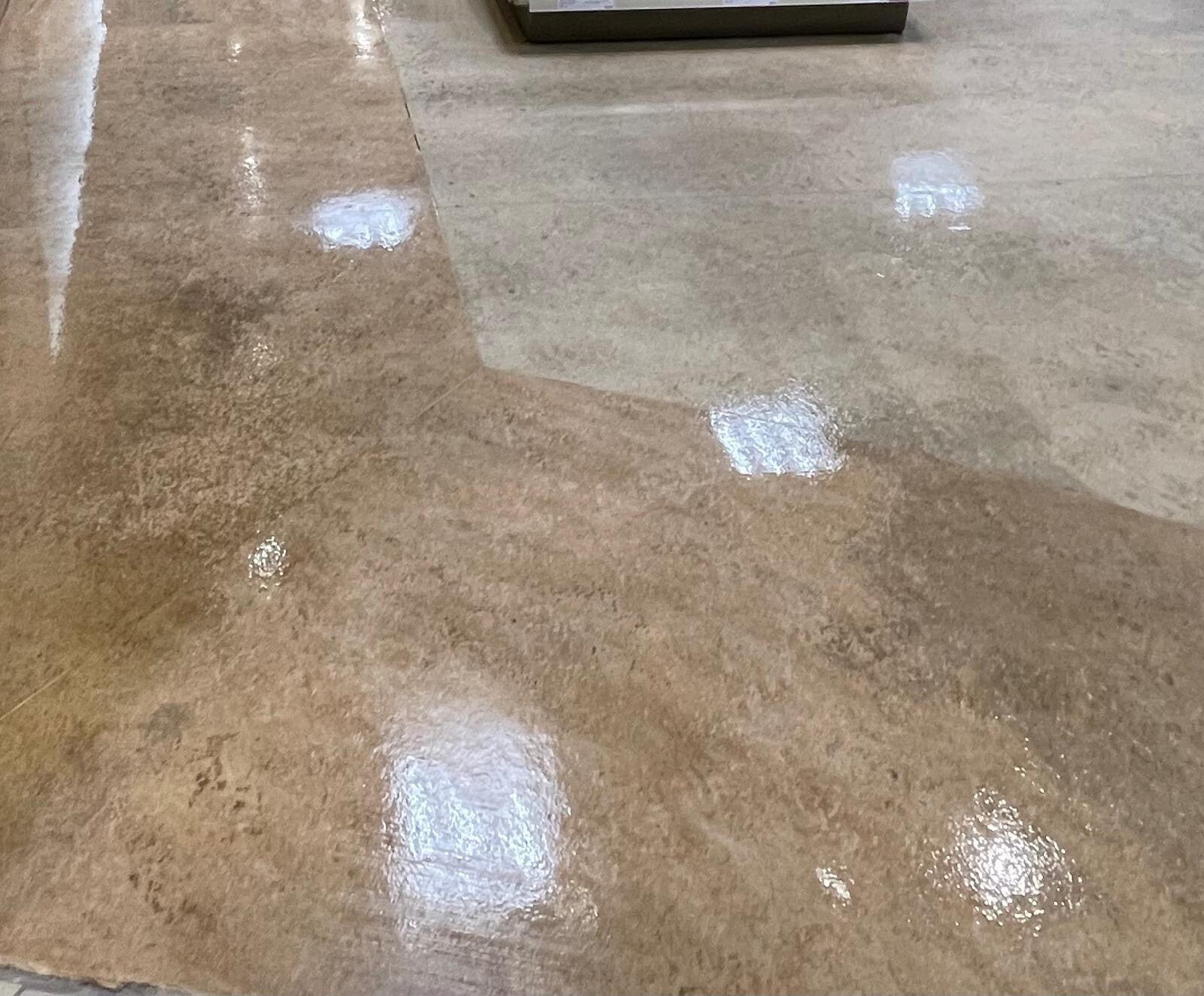 Polished commercial floors with a glossy, reflective finish showcasing professional deep‑cleaning and floor‑restoration quality.
