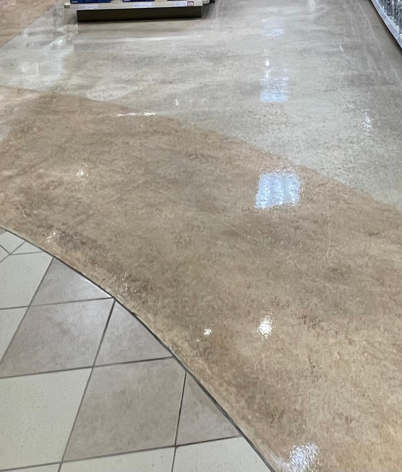 Polished commercial floors with a glossy, reflective finish showcasing professional deep‑cleaning and floor‑restoration quality.