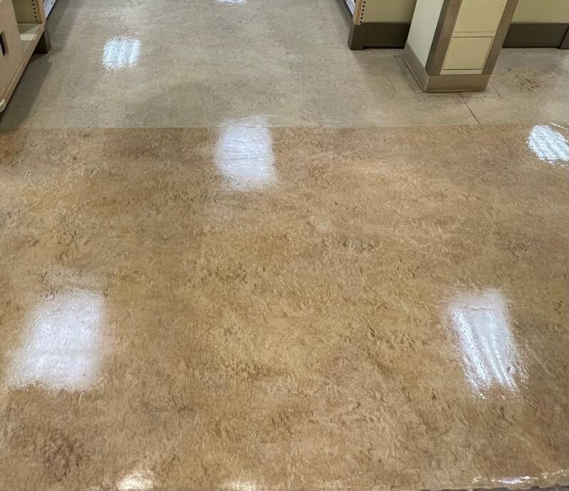 Polished commercial floors with a glossy, reflective finish showcasing professional deep‑cleaning and floor‑restoration quality.
