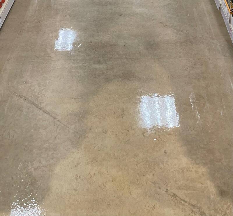 Polished commercial floors with a glossy, reflective finish showcasing professional deep‑cleaning and floor‑restoration quality.
