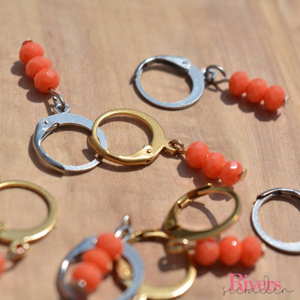 Oranje glaskralen hangers - zilverkleurig