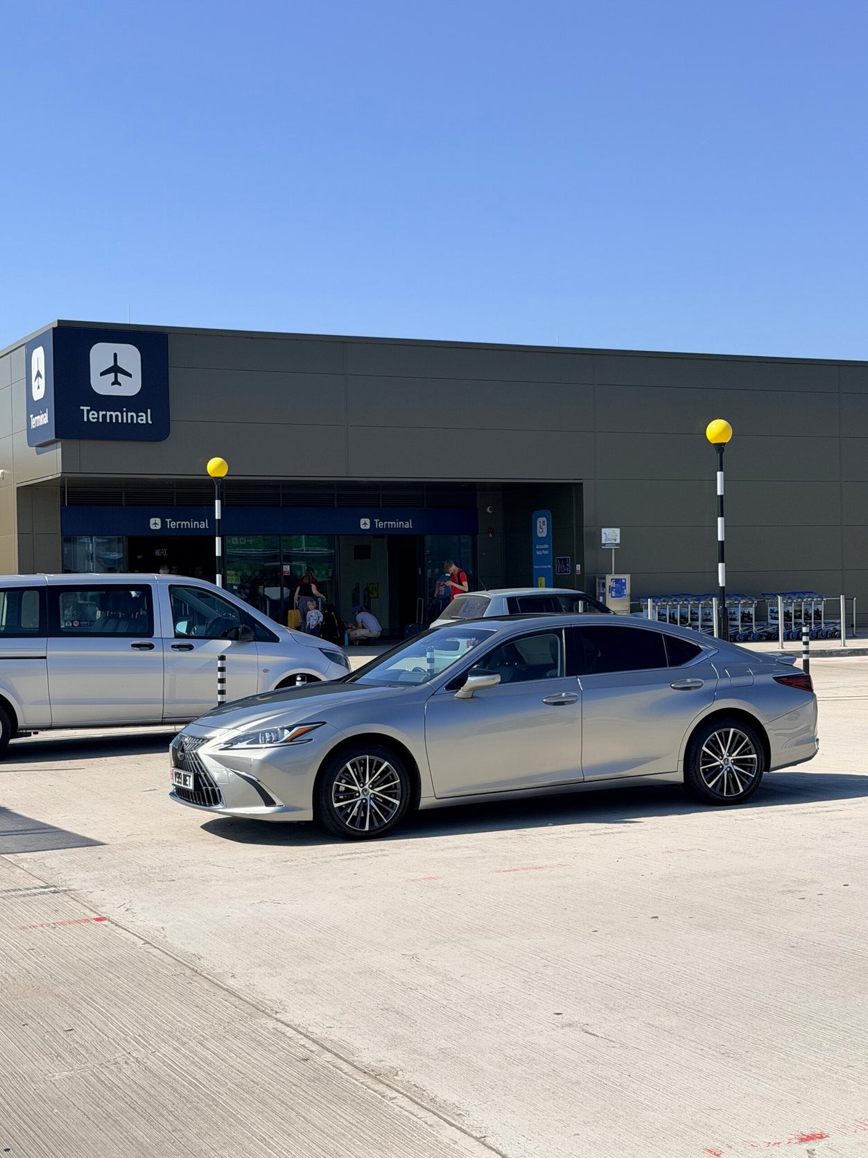 Beyond Elite Travel executive saloon at Bristol Airport terminal on a pre-booked airport transfer