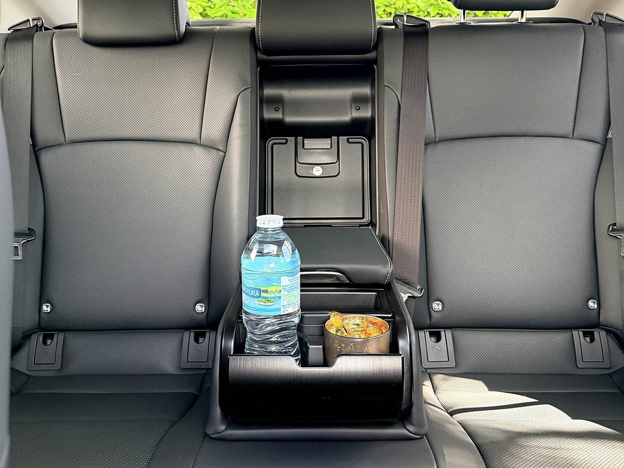 Rear seat of the executive saloon with complimentary bottled water for Bristol Airport transfers