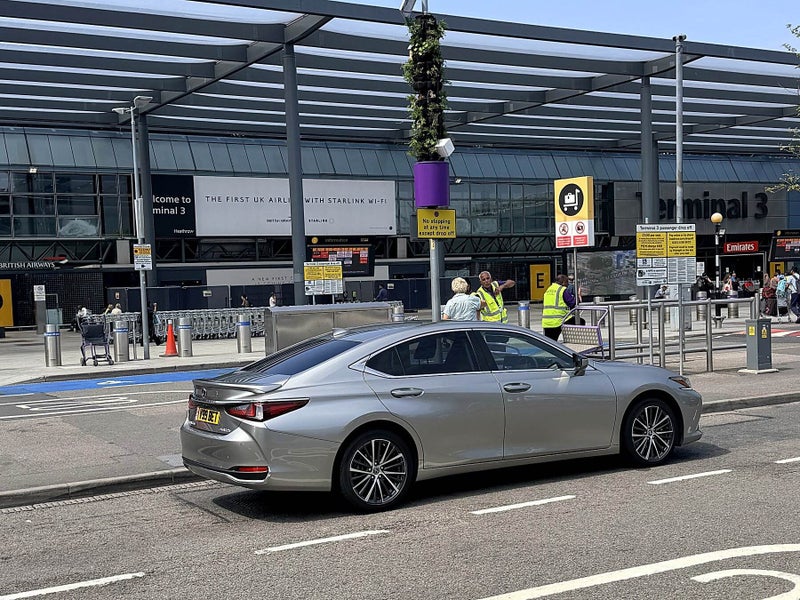 Executive saloon at Heathrow Terminal 3 collecting a passenger for a fixed-price transfer to Bristol