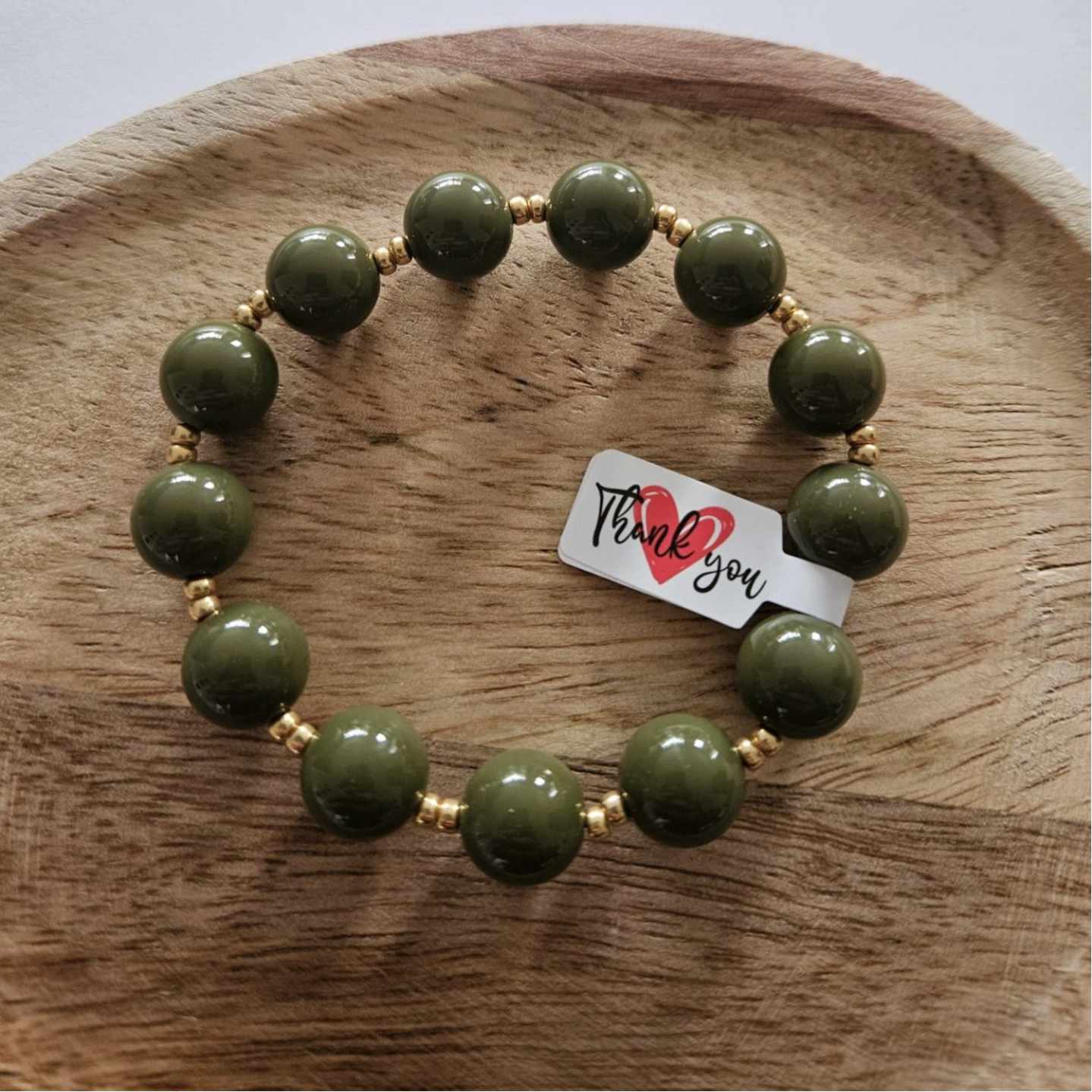 Armband mosgroen - ronde kraal met goud