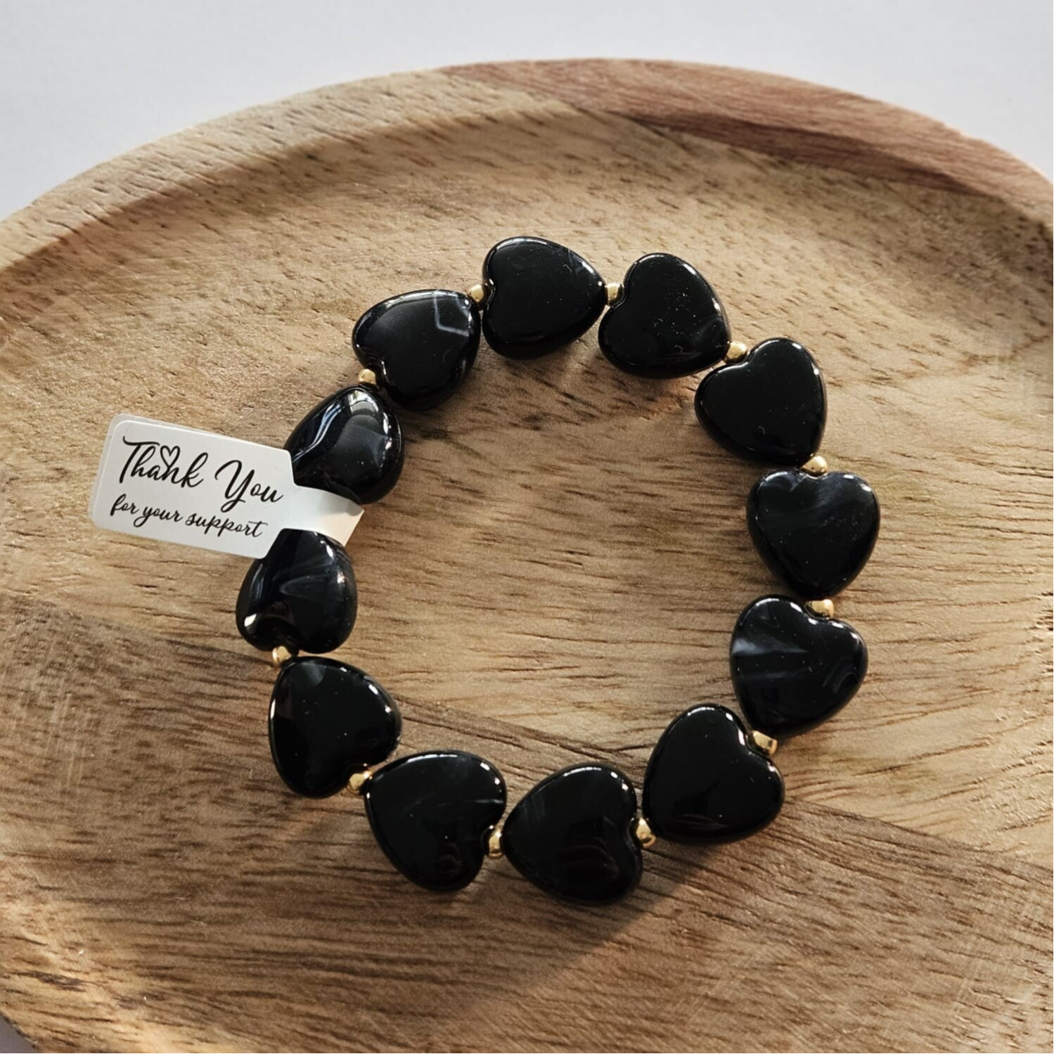 Armband zwart- hartjes met goud