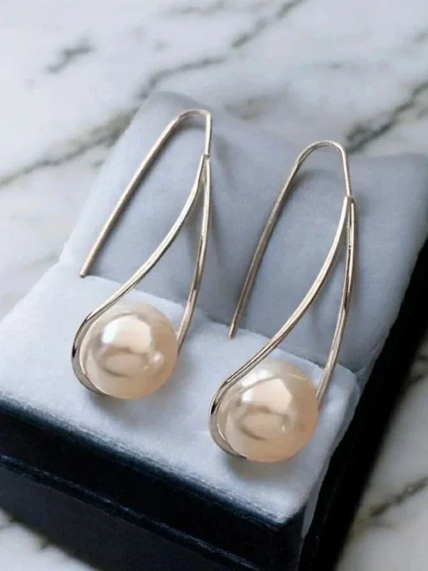 Boucles d’oreilles pendantes perle & métal doré