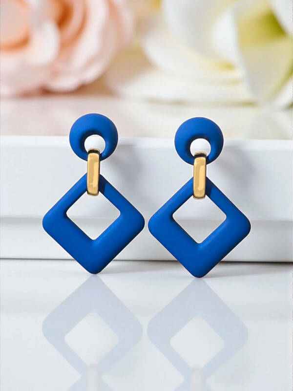 Boucles d'oreilles géométriques en bleu et doré, style moderne et audacieux