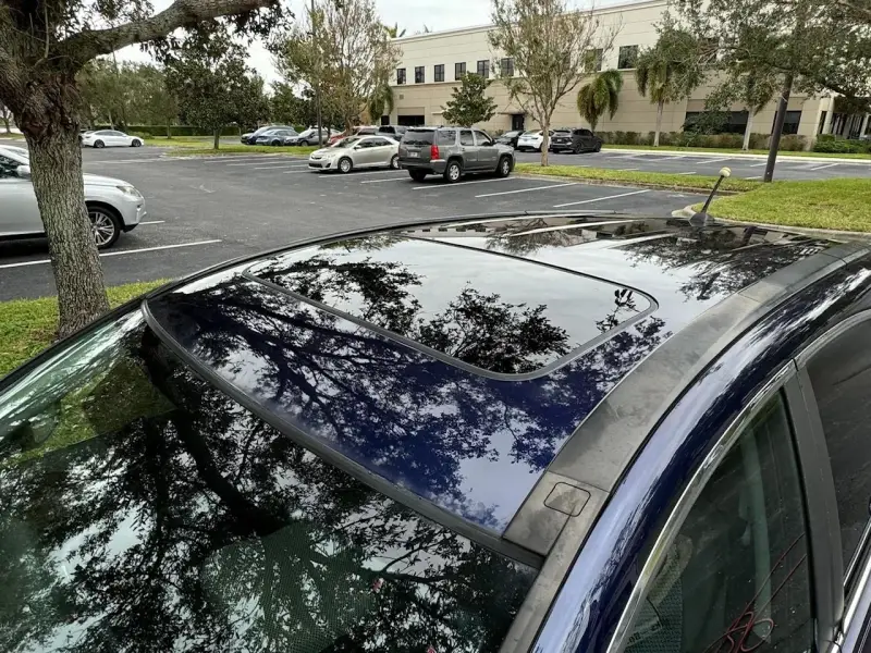 Clean and reflective car roof with enhanced shine and restored clarity following paint correction.