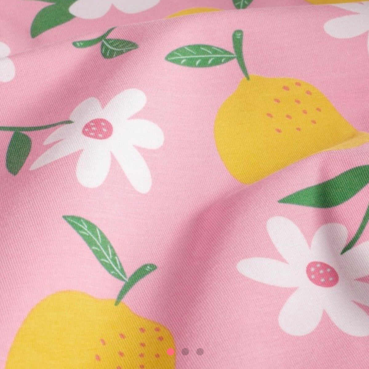Tissu jersey citron sur fond rose