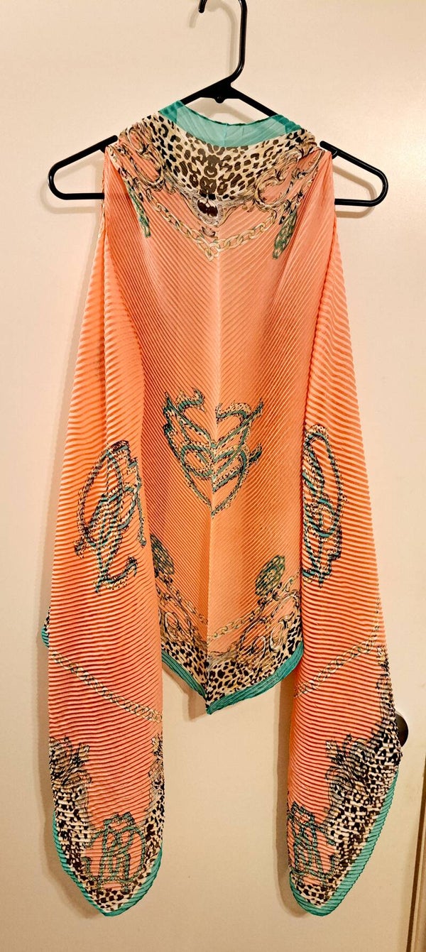 Beautifully lightweight, the Mix Print Cape/ Swimsuit Cover Up