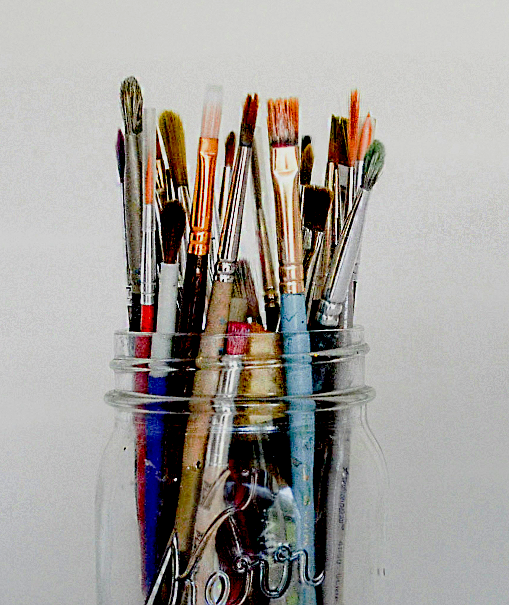 A photograph of a jar full of paintbrushes. Image by Debby Hudson from Unsplash. Edited with Adobe Photoshop.