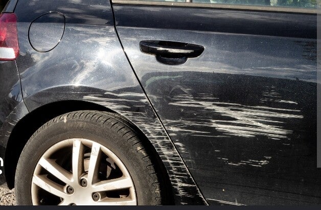 Mazda with deep scratches 