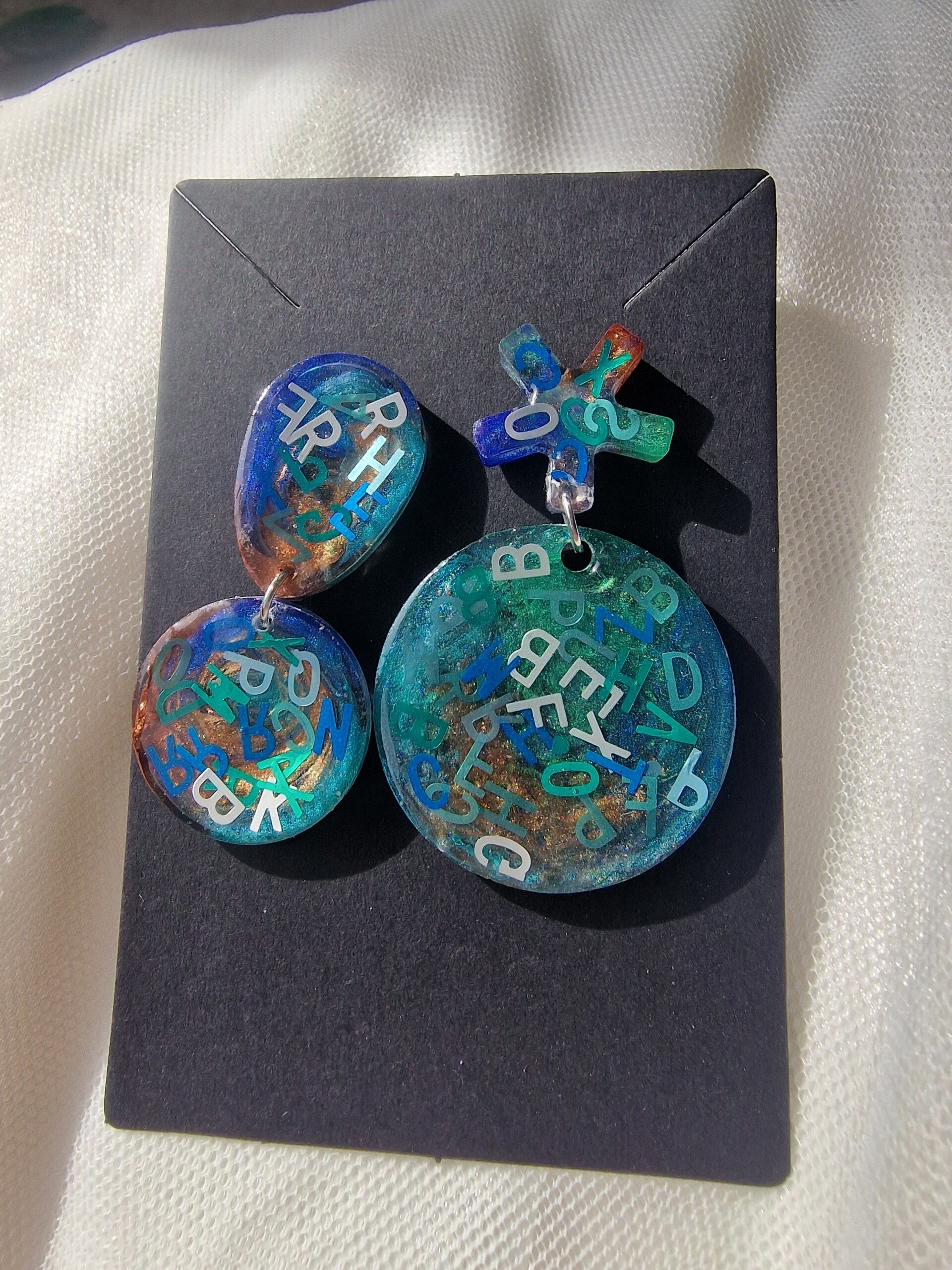 Boucle d'oreille abc