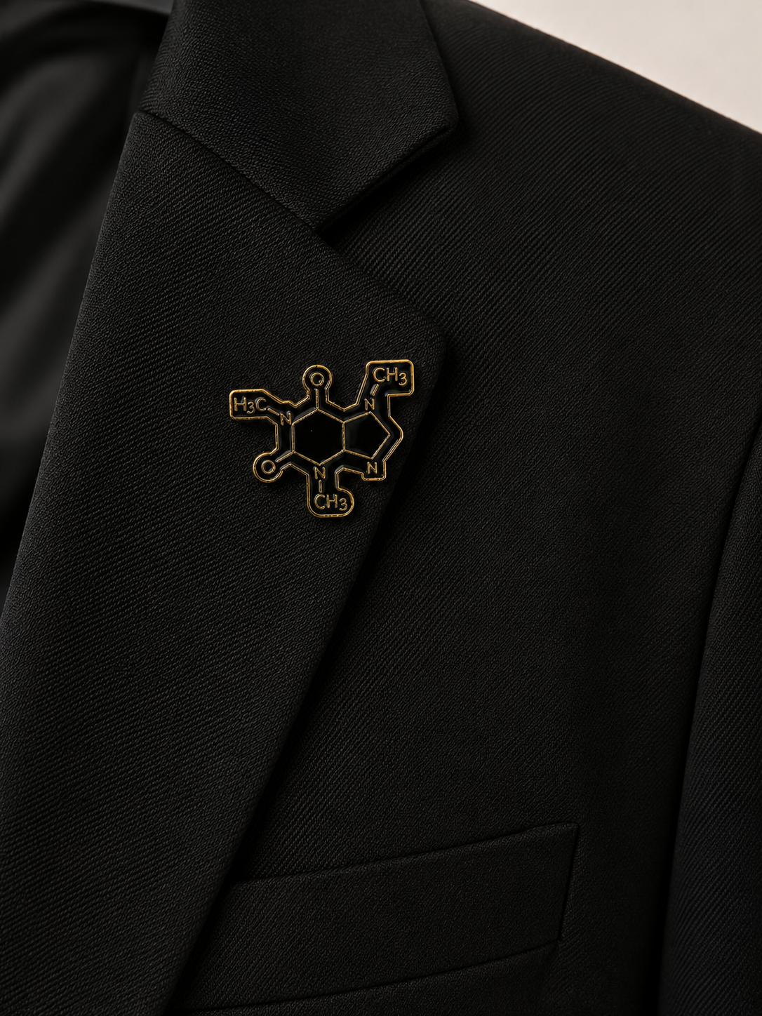 Pins atome noir