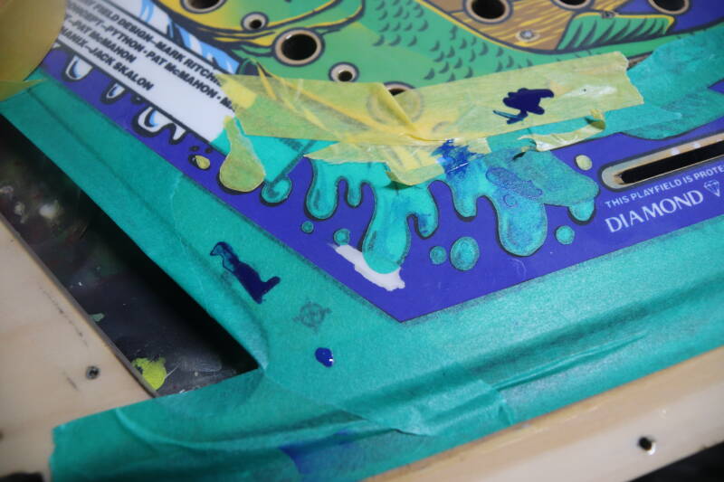 Williams Fish Tales playfield speelveld schade herstel restoration flipperspeelveld restauratie art airbrush airbrushing flipperkast reparatie