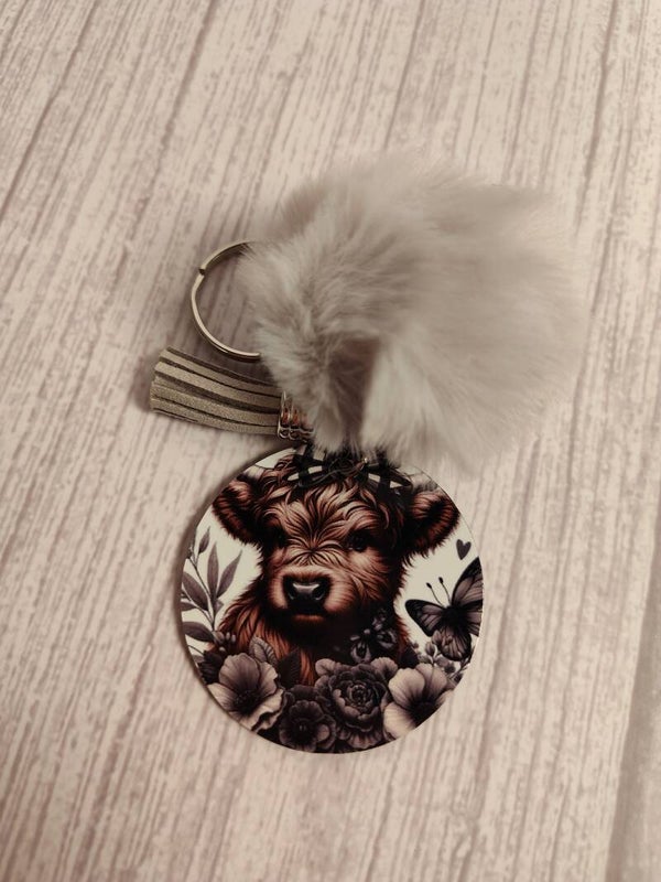 Cow keychain with puff and tassel