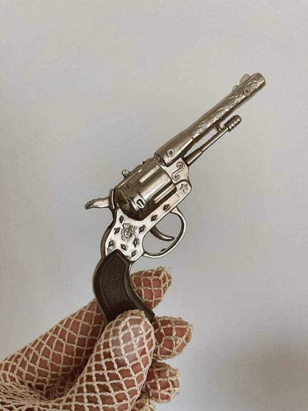 Petit revolver jouet – Esprit western des années 90