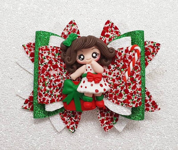 Meisje met cadeau kerststrik