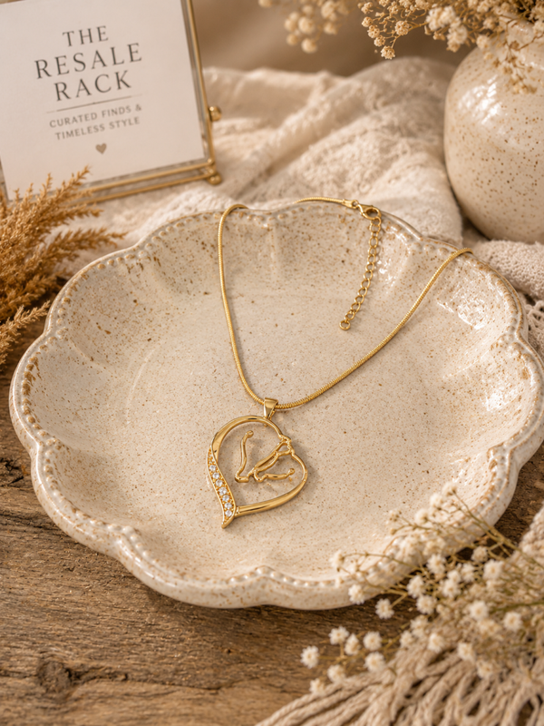 Gold tone horse head heart necklace