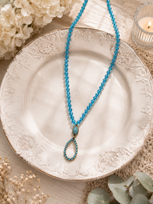 Long blue beaded tear drop necklace