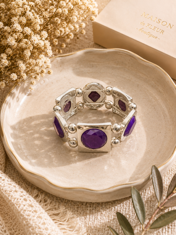Silver tone stretch bracelet with purple accents