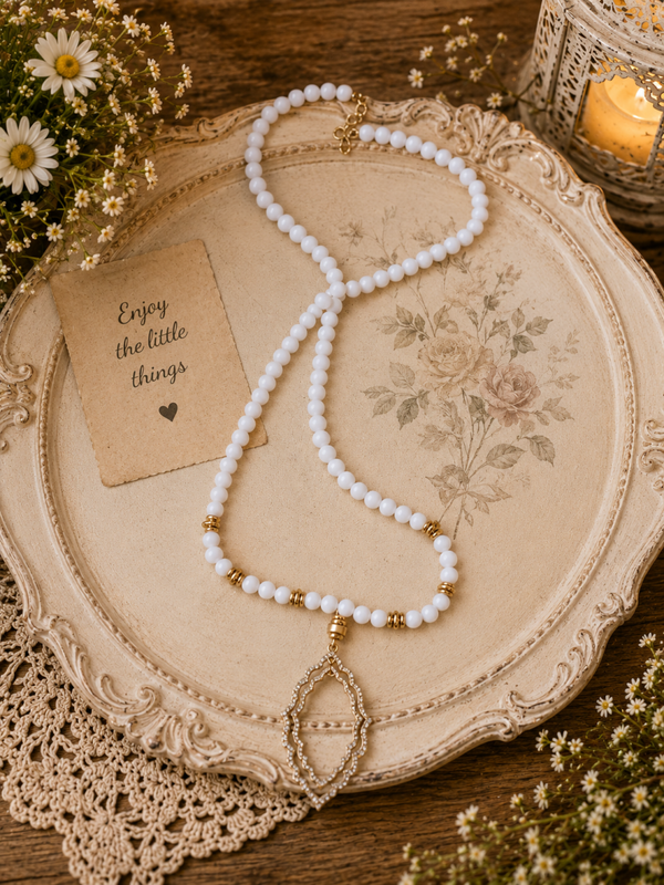 White and gold beaded adjustable necklace with gold charm