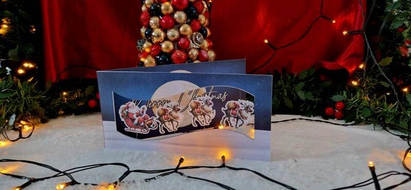 3. Langwerpige Kerstkaart, Kerstman in de slee met de rendieren, (bewegend)