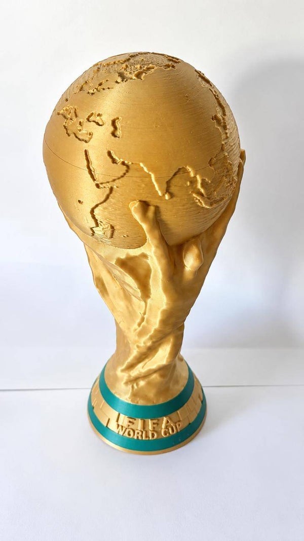 World Cup trophies with a can holder